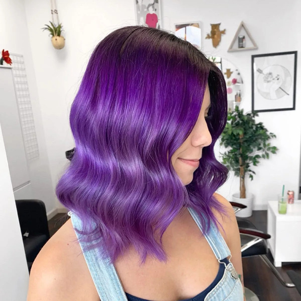 Soft and Shine Cosmic Purple with Black Roots - a woman wearing a denim jumper