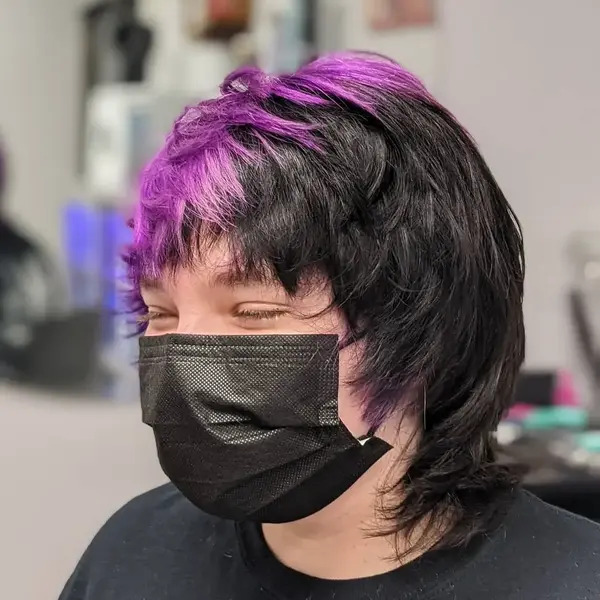 Split Color for Messy Mullet Cut - a woman wearing a black face mask