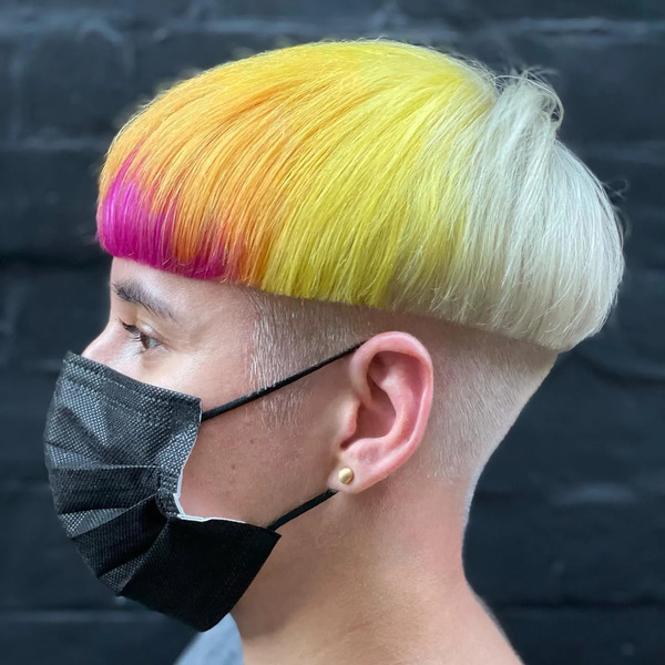 Sunset Tint for Mushroom Haircut - a woman wearing a black face mask