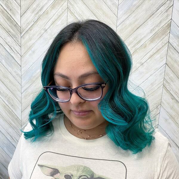 Turquoise Wavy Ombre Hair - a woman wearing an eyeglasses