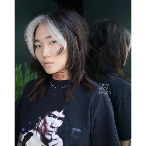  Long Shag Haircuts for Women- a woman in a black t-shirt
