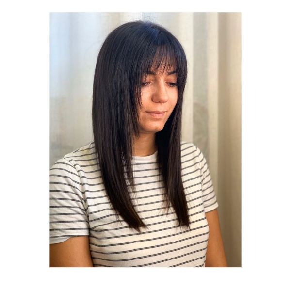 Straight Long Shag Haircuts for Women - a woman with a white t-shirt with stripes