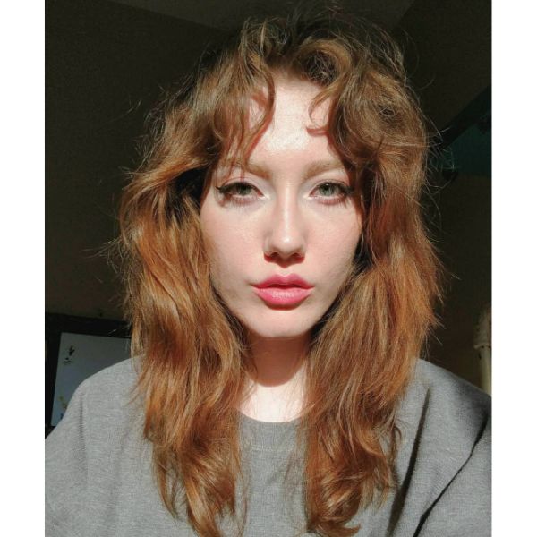 Wavy Long Shag Haircut with Curly Bangs for Red Hair