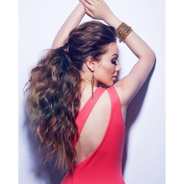 Voluminous Messy Updo with Wavy Ponytail and Colored Highlights for Long Hair
