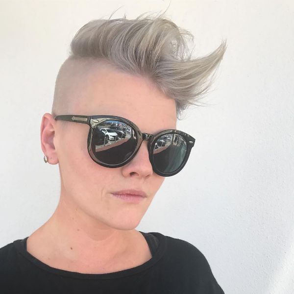 A woman wearing sunglasses with haircuts for women cut