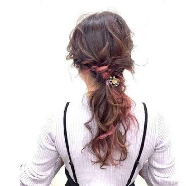 Messy Braided Ponytail with Pink Highlights