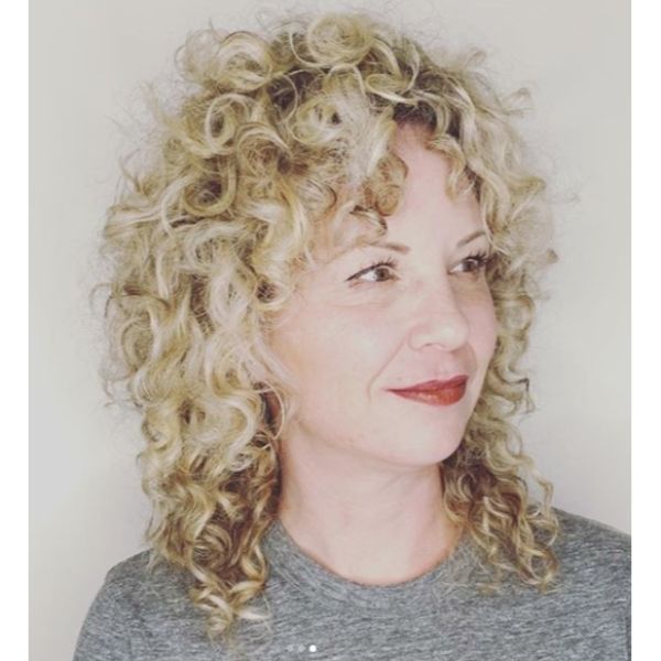 Curly Blonde Shag Hairstyle For Women Over 50