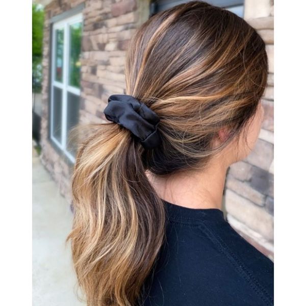 Loose Ponytail With Thin Blonde Highlights