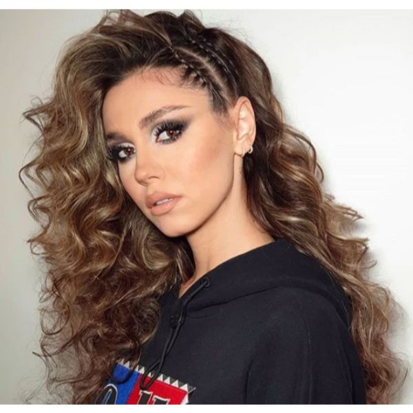 Voluminous Curly Brown Hair with Side Cornrows and Sublte Blonde Baby Lights