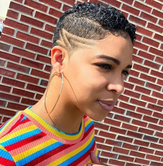 a woman with High Taper Fade with Razor Side Design Shaved Hairstyles for Black Women