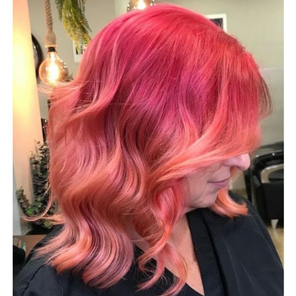 Long Coral Pink Haircut For Wavy Hair
