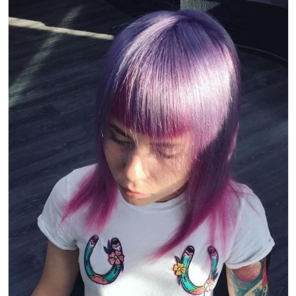 A girl sitting with her purple pink long with straight bangs hairstyle