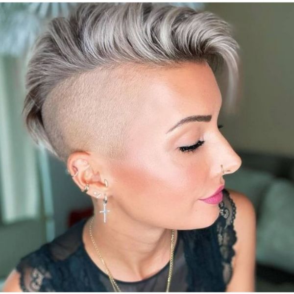 A girl with her sleek ashy grey undercut with faux hawk hairstyle 