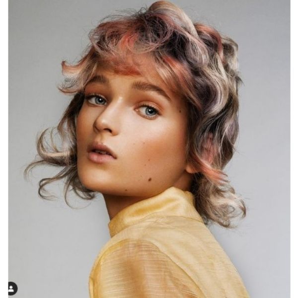 Glam Rock Hairstyle With Pastel Colored Curls For Thin Hair