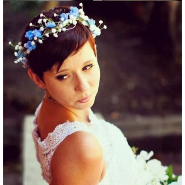 a woman with Auburn Pixie wedding hairstyles for short hair With Floral Headband