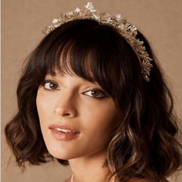 a woman with Curly Bob With Soft Balayage With Headband