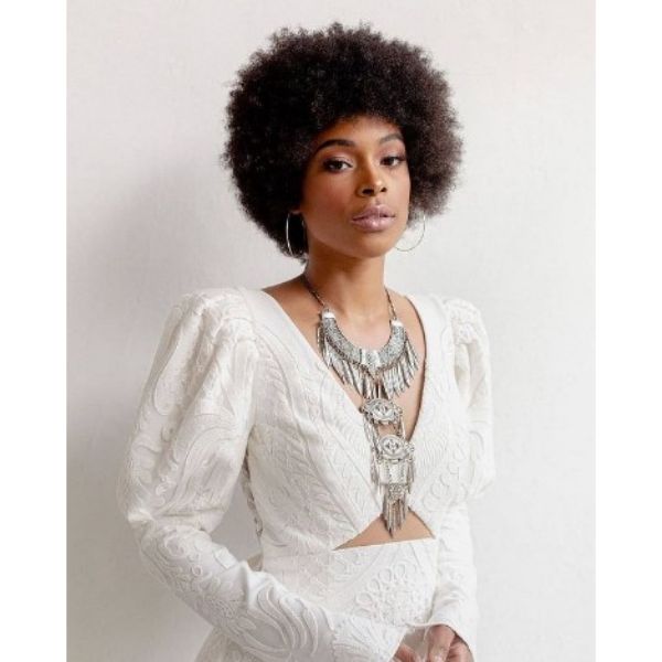 a woman with Dark Afro With Disco Influences wearing an elegant necklace