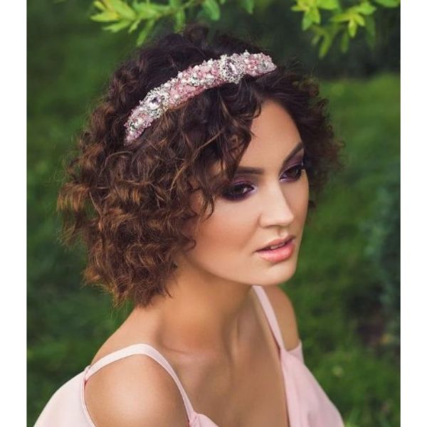 a woman with Short Curly Bob With Pink Jewel Headband