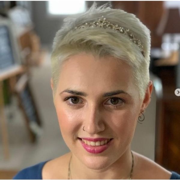 a woman with Short Spiky Blonde Pixie With Headband and nose piercing