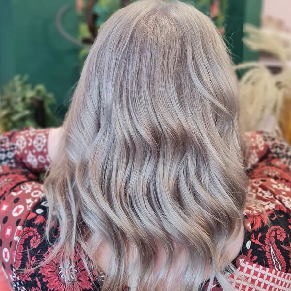 Ice Grey Blonde Short Hair - A woman wearing her boho top