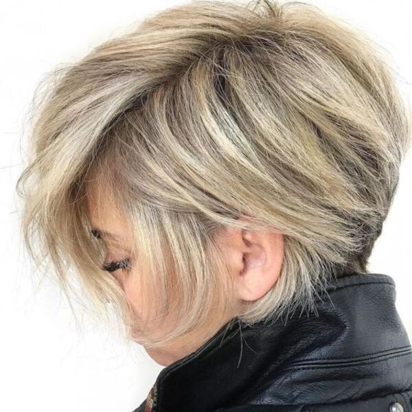 Longer Side-Parted Style Pixie Cut - A woman in her black leather coat