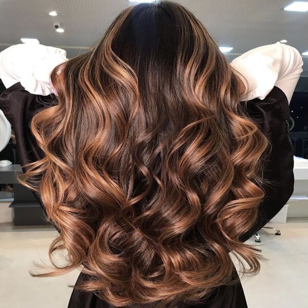 Chocolate Caramel Balayage for Long Hair - A women in a white long sleeve