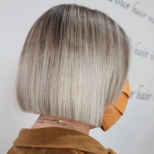 Blended Ash Brown and Steel Silver Hair - A woman in a brown top