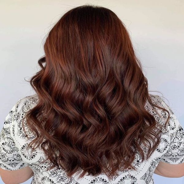 Wavy Dark Chocolate for Wavy Hair - A woman wearing a black printed white top