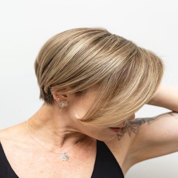 Long Neat Pixie for Fine Hair - A woman with a tattoo