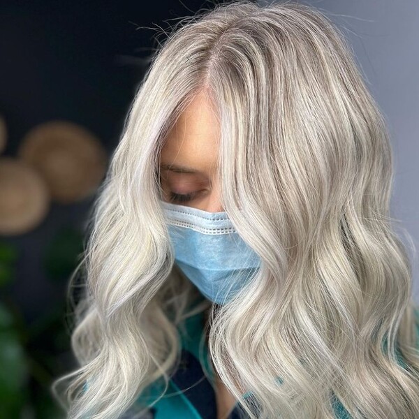Ash White Hair - a woman closing her eyes and is wearing a surgical mask