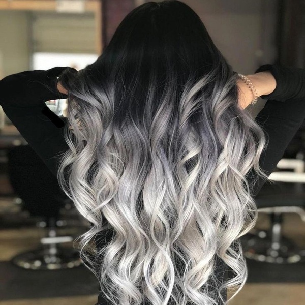Black Roots and White Blonde Balayage - a woman wearing a black fitted long sleeve