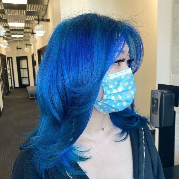 Bright Blue Wolf Haircut Korean - a korean girl wearing a facemask and has a long eyelash extensions