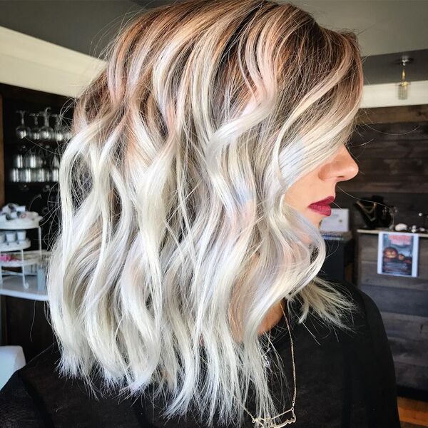 Brown and Platinum Blonde Balayage - a woman wearing a black shirt and a red lipstick