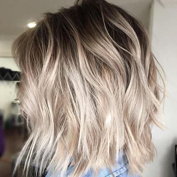 Brown and Platinum Blonde Short hair - a woman wearing a denim polo shirt