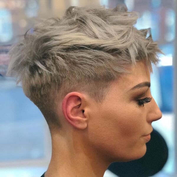 Choppy Pixie With Ash Blonde Tones - a pretty woman wearing a make up