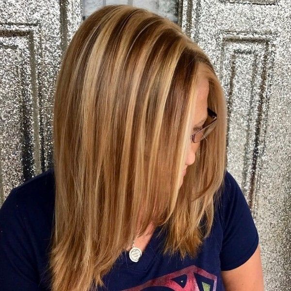 Chunky Blonde Highlights - a woman wearing an eyeglasses