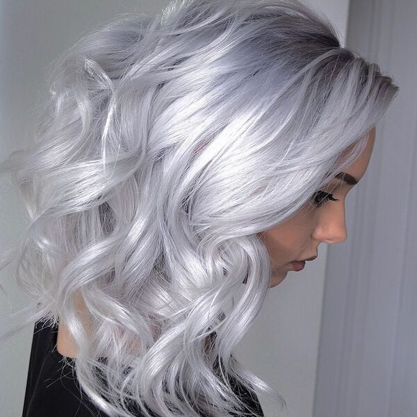 Lilac Silver Blonde Hairstyle - a beautiful woman wearing a black shirt