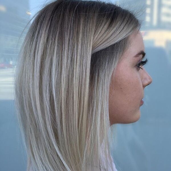 Long Bob with Cool Ash Blonde Balayage - a woman with a thick eyelashes