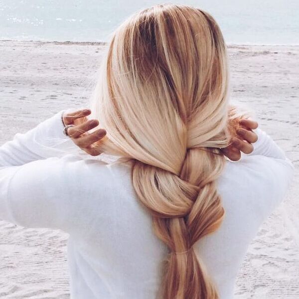 Loose Braid With Ash Hair - a woman in a beach wearing a white long sleeve