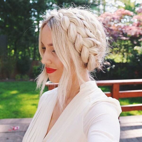 Platinum Blonde with Crown Braid - a woman wearing a dark red lipstick