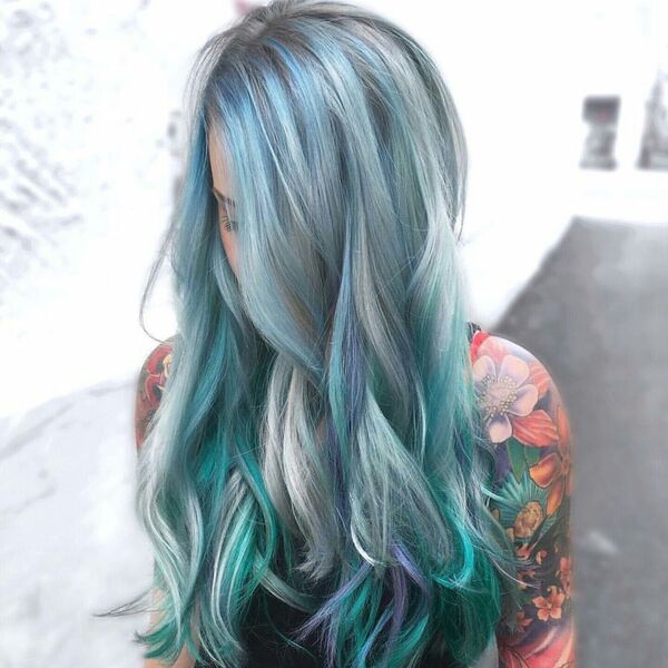 Platinum Blue Hair - a woman covered with floral tattoos