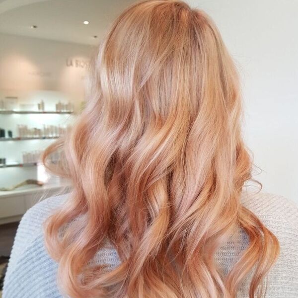 Rose Gold Blonde for Long Hair - a woman wearing a light gray crochet top