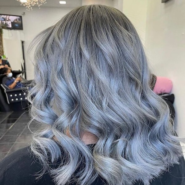 Silver Gray Hair - a woman sitting in a salon chair