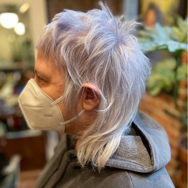 Wolf Cut Platinum White Hair - an old woman wearing a facemask