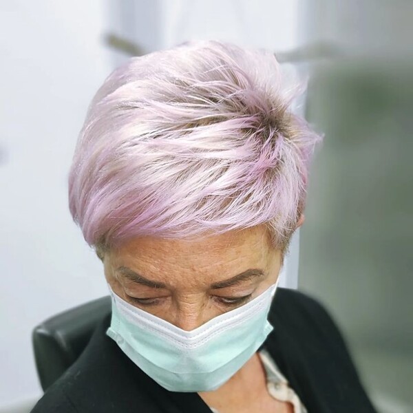 platinum pink hair - an old woman wearing a facemask