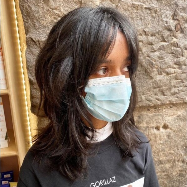 shaggy wolf cut hairstyle - an asian girl wearing a facemask