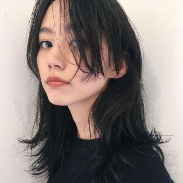 tiktok wolf cut - a young female wearing a black shirt