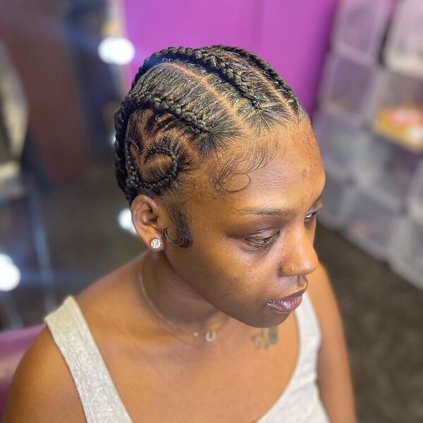 6 Feed In Braids with Design - A woman with necklace wearing a color gray sleeveless top