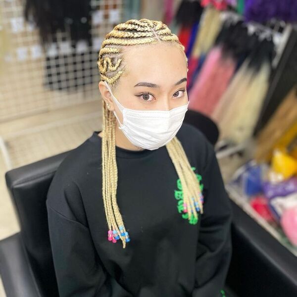 Blonde Hair Cornrow Braids - A woman wearing a black sweater and a face mask