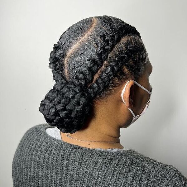 Braided Bun - a woman wearing a knitted gray sweater